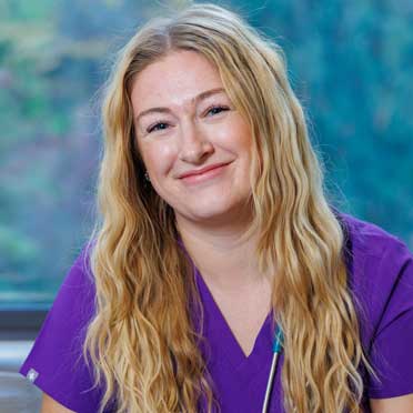 Smiling nurse wearing scrubs